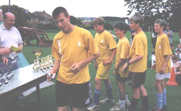 B team receive their runners up trophies...