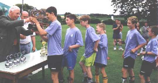 A team receive their trophy...